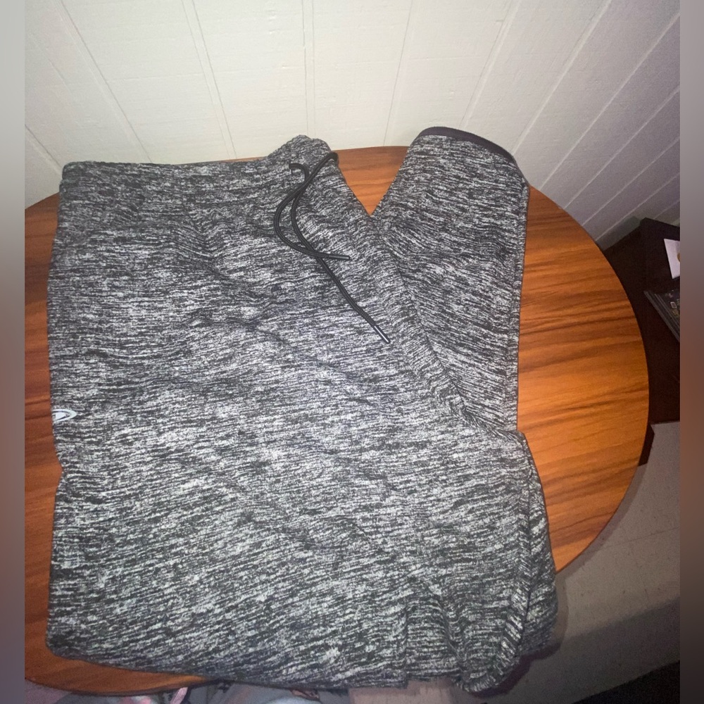 Grey sweatpants with a baggy fit